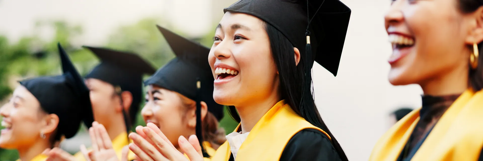 East Asian university students studying together on campus