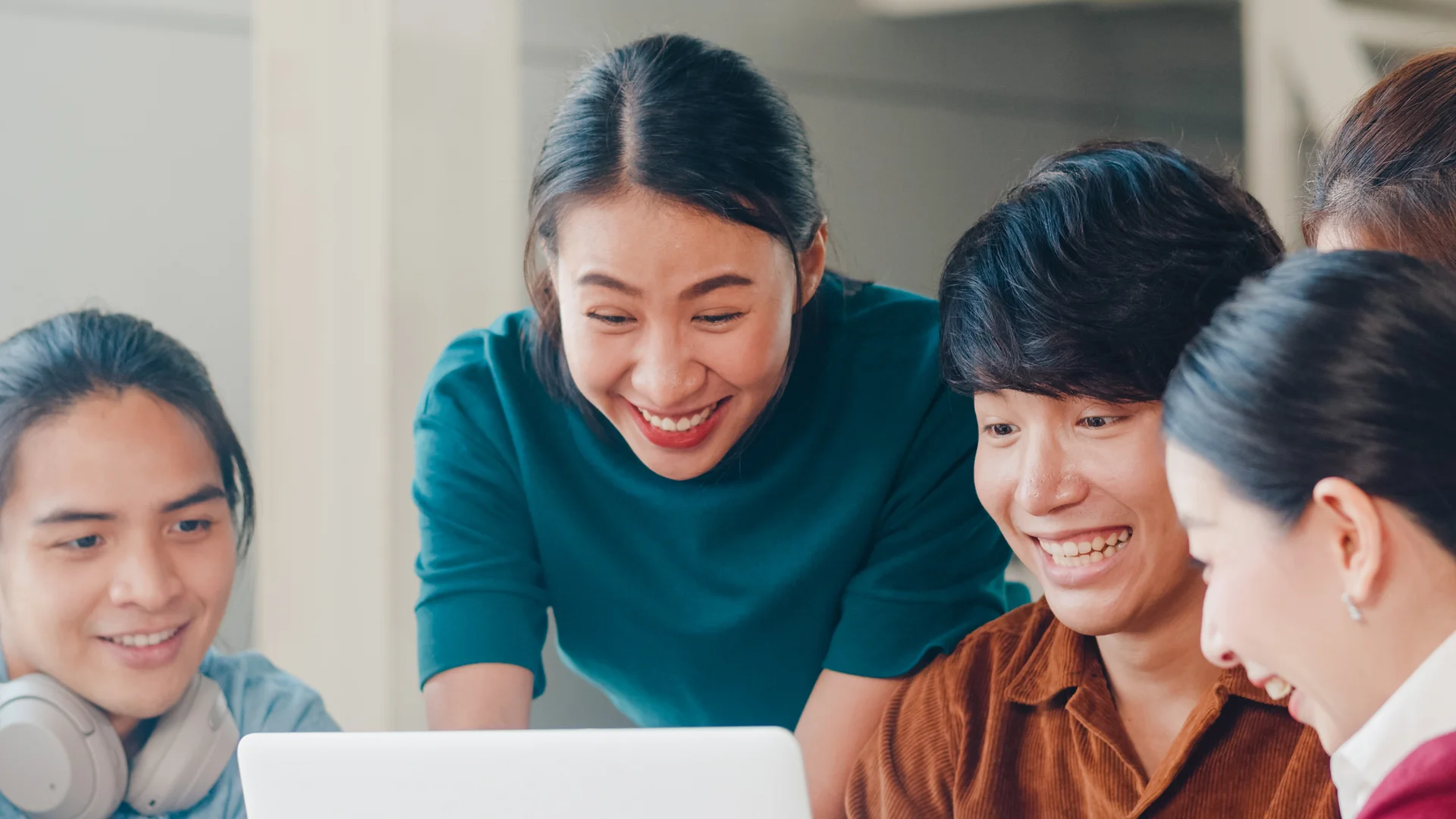 Education adviser guiding an East Asian student through programme options