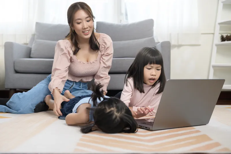 East Asian parent reassuring child about studying abroad